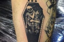 Skeleton and girl tattoo on the arm