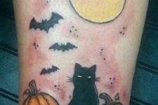 Two pumpkins, black cat, full moon and bats tattoo