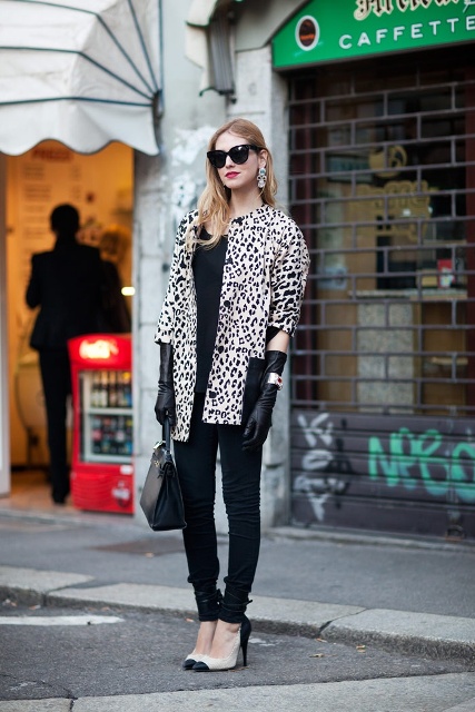 With black shirt, black pants, two color shoes, printed coat and bag