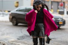 With black shirt, leather skirt, leather over the knee boots and purple coat