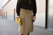 With black sweater, wrap midi skirt and yellow clutch