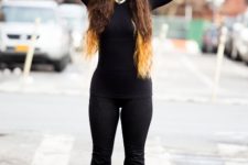 With black turtleneck, flare pants and boots