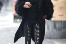 With black turtleneck, fur coat and two color shoes