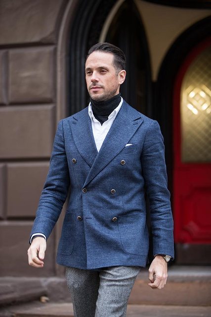 With blue blazer, gray tweed trousers and white shirt