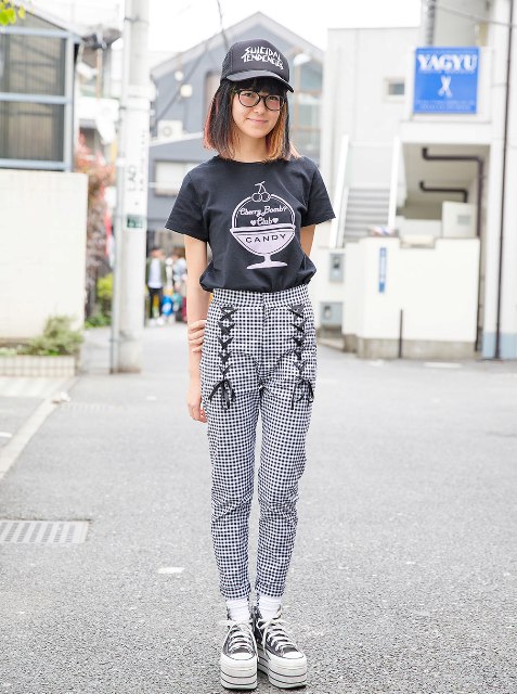 With cap, printed t-shirt and platform shoes