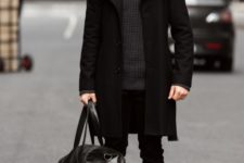 With dark gray sweater, black coat, skinny pants, mid-calf boots and big bag