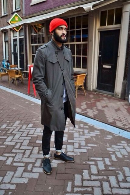 With dark gray trench coat, cuffed jeans and black boots