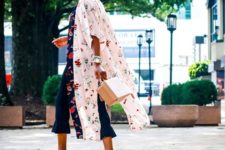 With floral airy coat, colorful heels and small bag