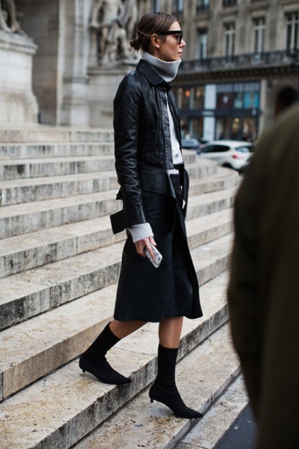 With gray turtleneck, midi skirt and leather jacket