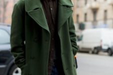 With green coat, brown shirt and jeans