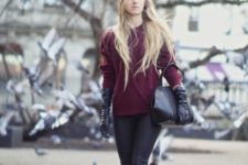 With marsala sweater, skinny pants, heeled boots and black bag