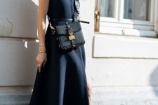 With navy blue dress, black ankle boots and crossbody bag