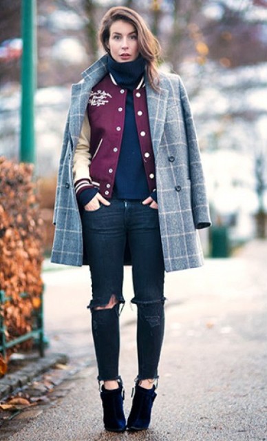With navy blue turtleneck, bomber jacket, distressed jeans and ankle boots