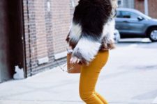 With orange pants, black boots and brown clutch
