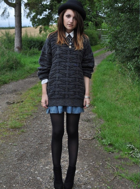 With oversized sweater, denim mini skirt, black tights and ankle boots