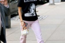 With pale pink pants, white boots, mini bag and t-shirt