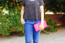 With printed blouse, black flats and pink clutch