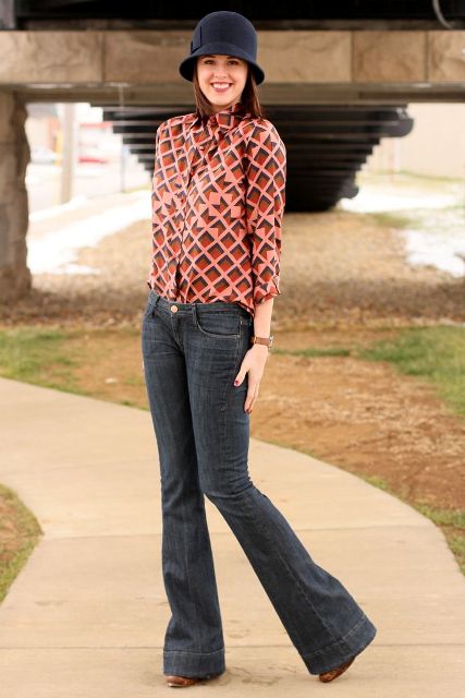 With printed blouse, flare jeans and brown boots