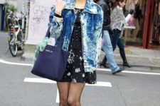 With printed dress, sneakers and blue bag