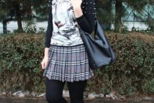 With printed shirt, skirt, black boots and leather bag