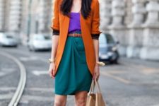 With purple blouse, green skirt, brown cardigan and belt