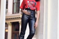 With red printed shirt, leather pants and boots