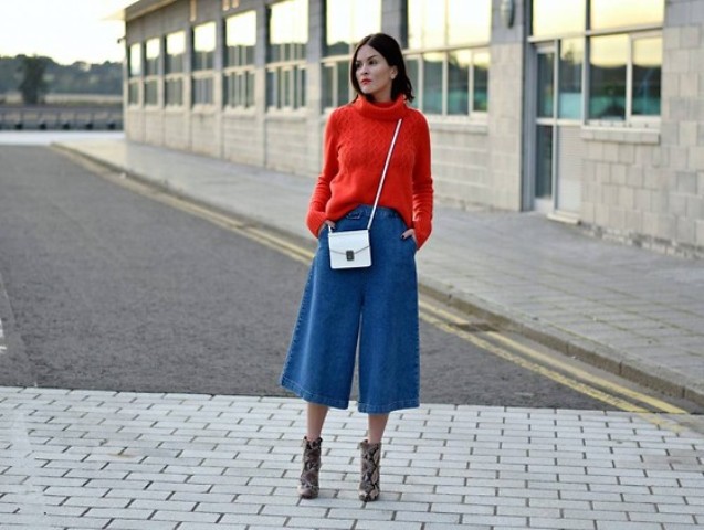 With red sweater, printed ankle boots and mini bag