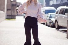 With ruffle sweater and metallic loafers