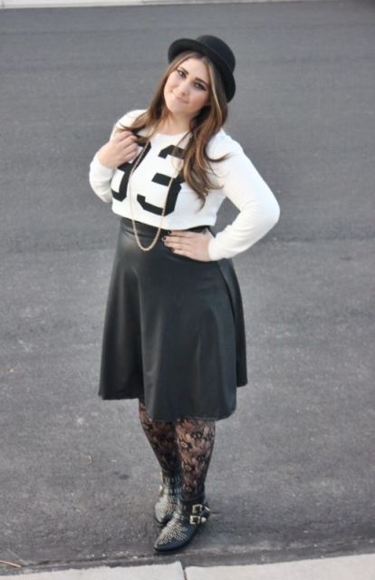 With shirt, leather knee-length skirt and boots