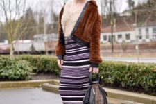 With striped midi skirt, beige shirt, printed bag and black boots