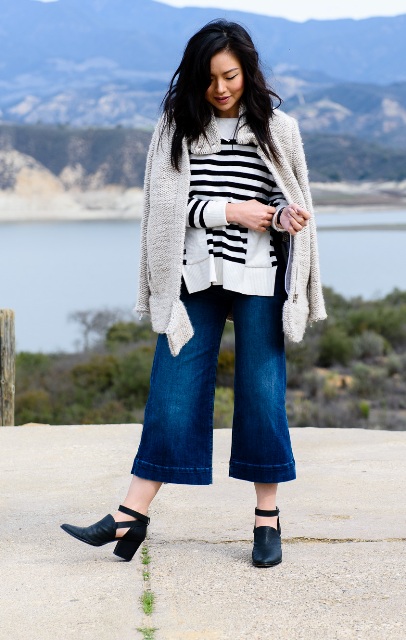 With striped shirt, white cardigan and black cutout boots