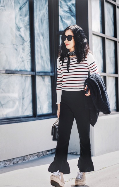With striped sweater, platform shoes and bag