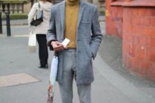 With tweed mini coat, gray trousers and black boots
