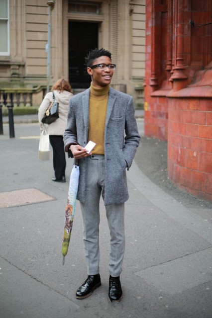 With tweed mini coat, gray trousers and black boots
