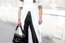 With white blouse, black heels and small bag