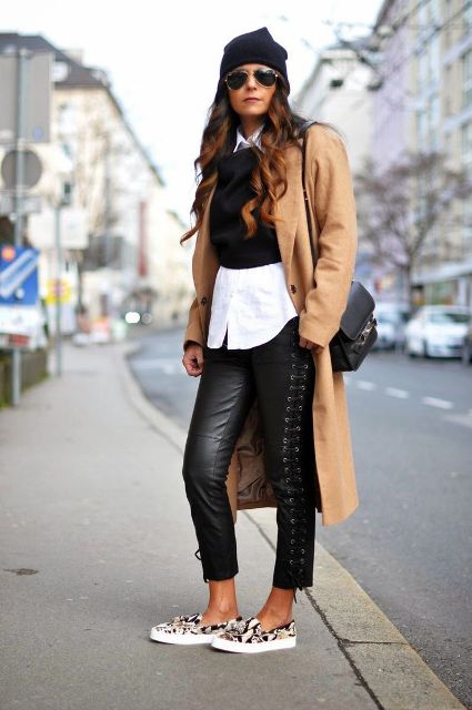 With white shirt, black vest, printed slip on shoes, camel midi coat and hat