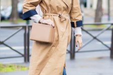 With white shirt, skinny jeans, square bag and camel trench coat