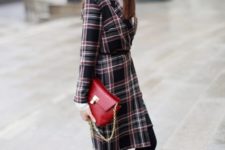 With white shirt, skirt, black tights, black ankle boots, red clutch and black cap