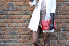With white shirt, wrap skirt, white coat, red clutch and flat shoes