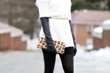 With white sweater, mini skirt, white belt, printed clutch and pumps