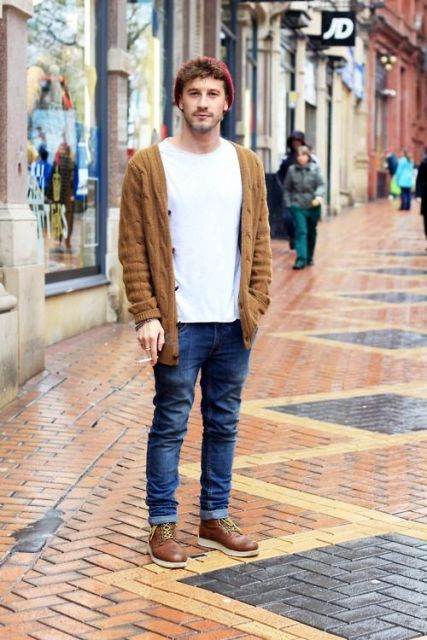With white t-shirt, jeans, brown boots and brown cardigan