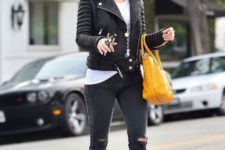 With white t-shirt, leather jacket, distressed jeans, ankle boots and orange bag