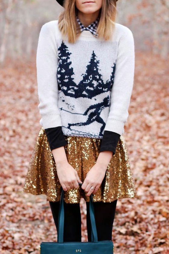 a printed ski sweater over a plaid shirt, a gold sequin skater skirt and black tights