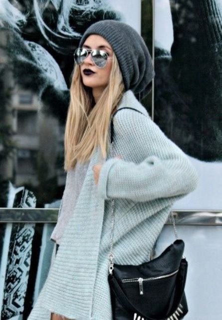 loose straight hair under a grey beanie looks chic and trendy