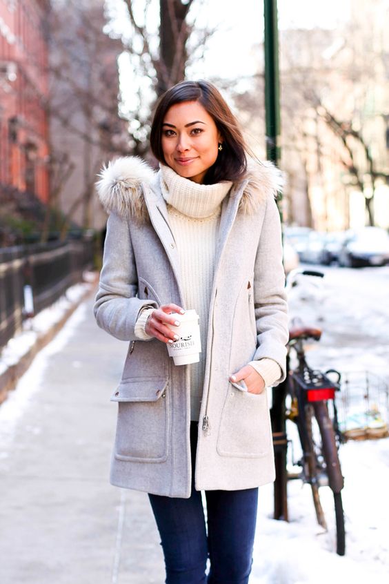 a grey winter coat with a faux fur hood, pockets and a zip is a comfy option