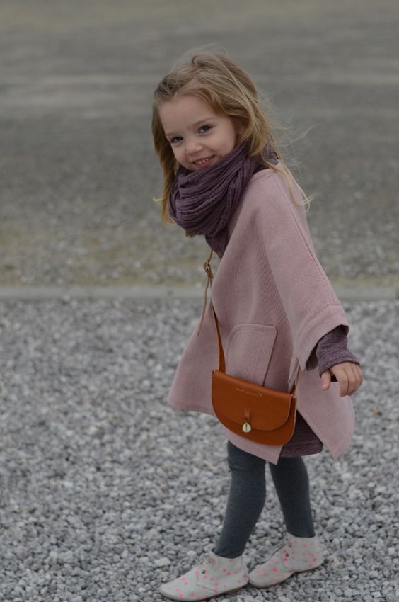a dusty pink coat and a chocolate brown scarf make up a cool combo