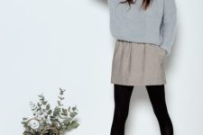 04 a printed mini skirt, an oversized grey sweater, black tights and amber chelsea boots
