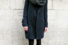 a navy textural coat and a black chunky knit scarf to feel cozy