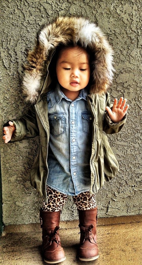 an olive green parka with faux fur, denim and a leopard print for a bold look