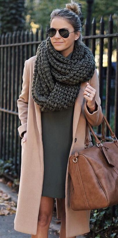 an olive green mini dress, a camel coat and a grey chunky knit scarf